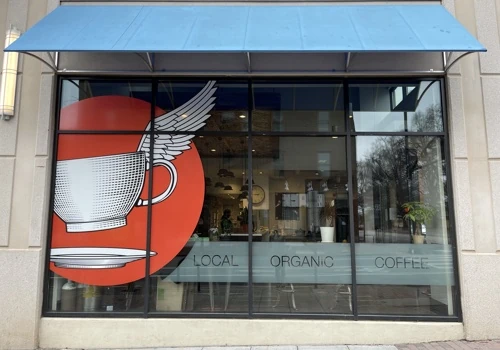 Rebrand and window graphics for storefront in downtown Raleigh NC | Vinyl business name
